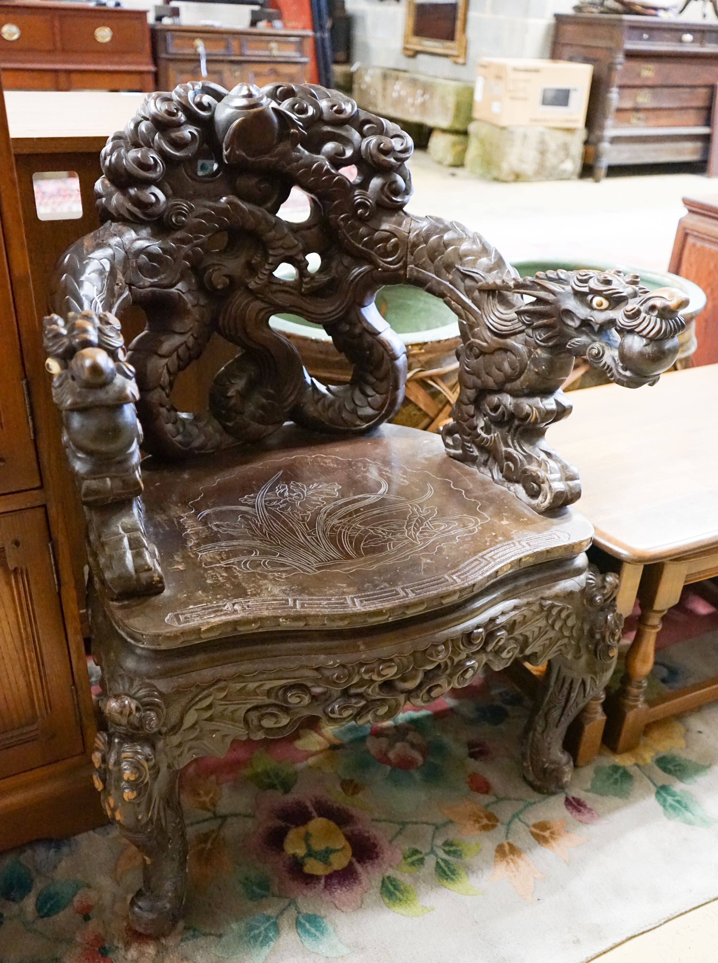 A Chinese carved hardwood 'dragon' elbow chair, width 68cm, depth 47cm, height 88cm